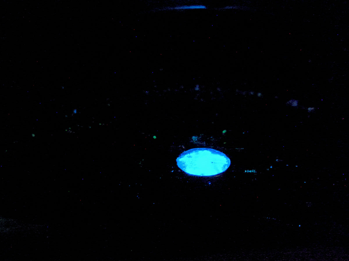 Under UV light it will glow